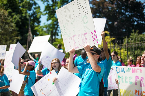 Boy holding Sign